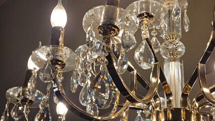 A stunning crystal chandelier with candle-shaped bulbs, exuding elegance and timeless charm. Perfect for luxury interiors, vintage decor, or sophisticated event themes