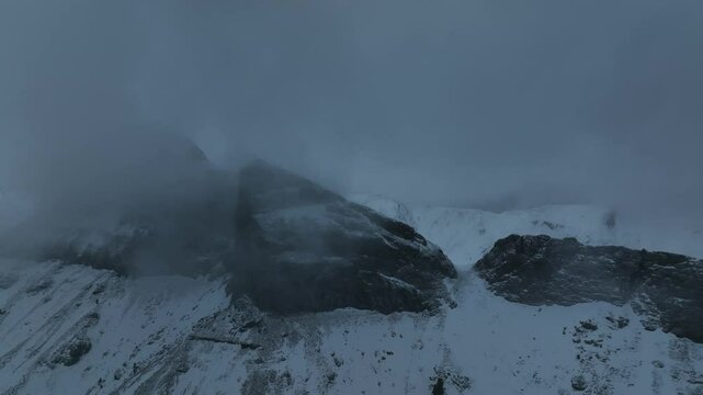 Spunta una croce tra le nuvole. 
Panorama alta val di Fassa, Trentino, Italia