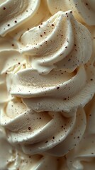 Creamy vanilla ice cream swirls with delicate chocolate sprinkles in soft frozen texture