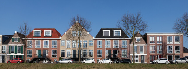 Modern colorful residential buildings along the water in the Vathorst district in Amersfoort.