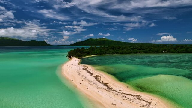 Aerial view of tropical beach with clear water and lush island, Port Vila, Shefa, Vanuatu.
