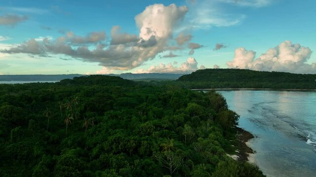 Aerial view of a moody sunset over a tranquil bay with clouds reflecting on the ocean, Port Vila, Shefa, Vanuatu.