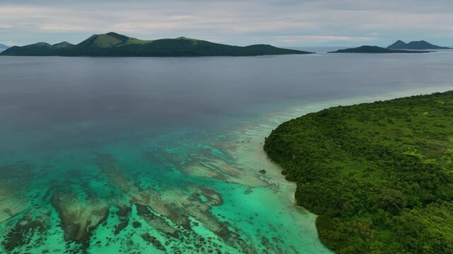 Aerial view of serene beach with lush palms and coral reef, Port Vila, Shefa, Vanuatu.