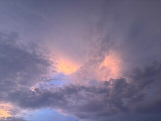 Beautiful sky with natural gradations. Thick clouds in the dusk sky on a winter night. Image of a cloudy sky in the afternoon. View of the night sky with golden light from the evening sun	