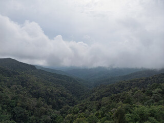 Tropical Forest Mountains in Indonesia Covered in Mist and Grey Clouds