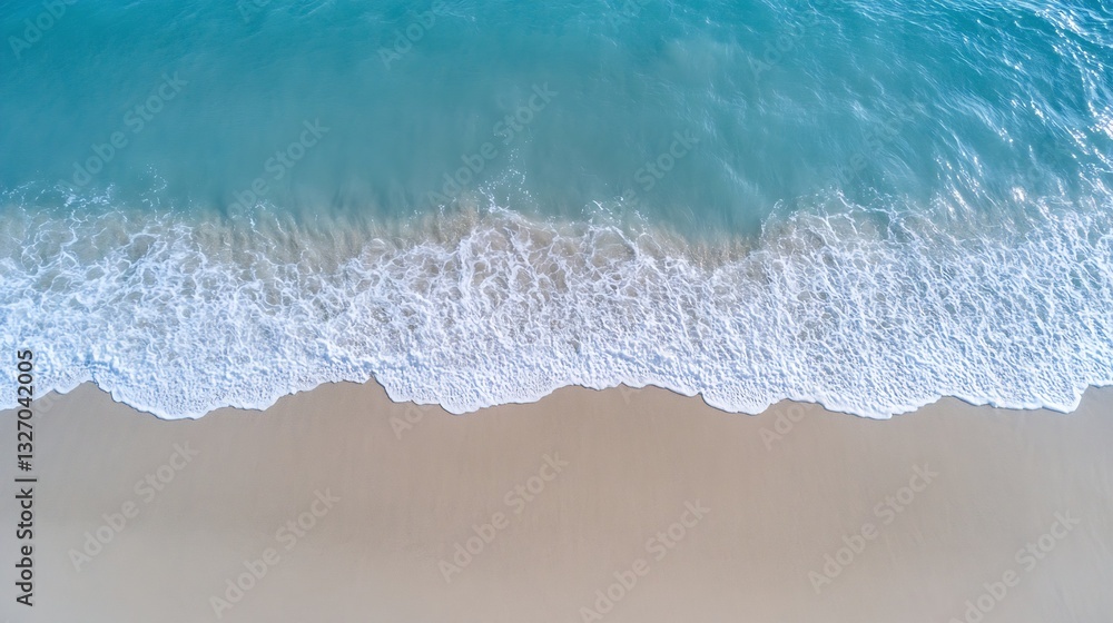 Poster aerial view of waves lapping gently on a sandy beach under bright sunlight in a tropical setting : g