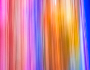 Vibrant colors blend together in a mesmerizing display of light and movement during a lively summer festival