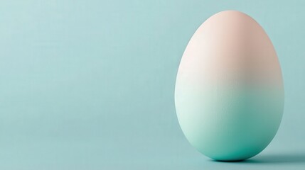 Fototapeta premium Pastel Ombre Easter Egg on Blue Background