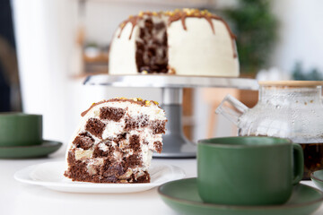 A piece of cake stands on the table.