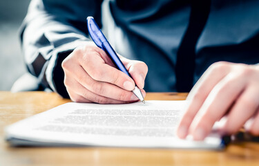 Settlement signature. Acquisition or buyout. Man signing insurance document. Car loan, lease or rental paper contract. Merger or business offer deed. Job recruitment, deal or partnership. Bank policy.