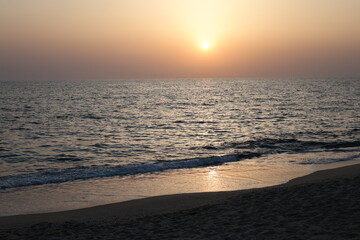 Sunset ocean horizon, mountains on the horizon