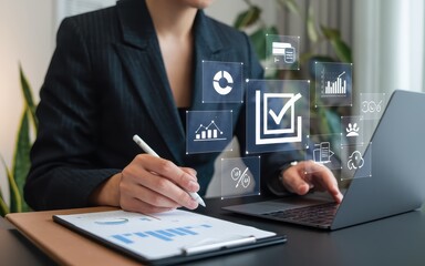 Businesswoman Analyzing Data on Laptop, Strategic Planning and Progress Tracking