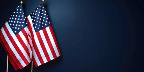 Obraz premium Two American flags hanging from the side of a wall, suitable for patriotic or national events