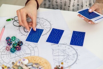 Fortune teller reading with tarot cards. light fortune teller