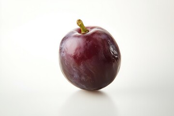 Obraz premium Fresh ripe plum fruit on white plain background displaying vibrant red hues and smooth texture close up