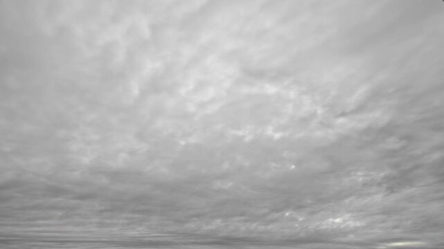 Timelapse of overcast sky with moving gray clouds