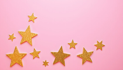 Obraz premium Golden shiny decorative stars on the pink background, top view, Side lit. White tone