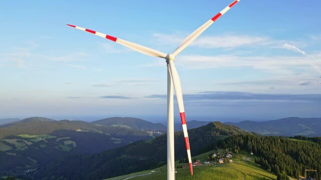 Aerial view of idyllic landscape with windmill and pasture in Grazer Bergland, Sommeralm, Styria, Austria.
