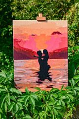 A vibrant painting displayed outdoors, placed on an easel amidst a beautiful natural landscape,...