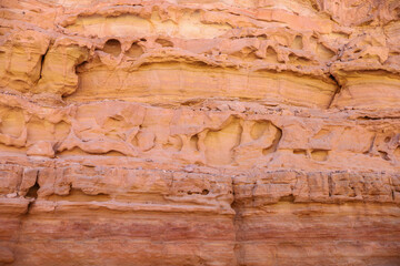 A textured background image of a rock with unevenness and cracks.