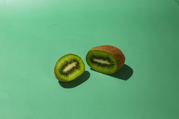 ripe kiwi on a green background