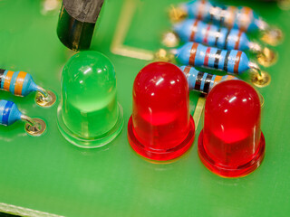 Macro detail on diodes on a green board.
