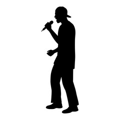 Silhouette of hip hop singer with baseball cap performing with microphone