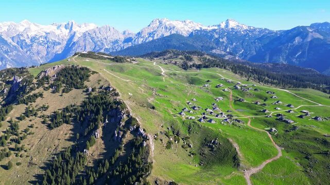 Aerial view of idyllic mountain landscape with a picturesque village and cabins, Velika Planina, Kamnik, Slovenia.