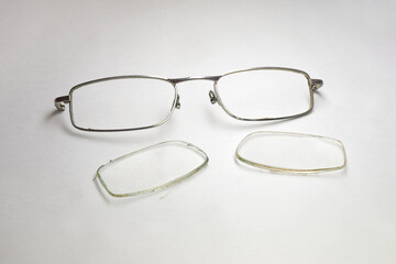 reading eyeglasses lenses, dismantled from thin worn metal front frame without temples