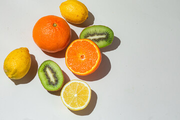 fresh citrus fruits on a light background