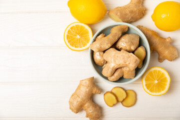 Fresh ginger on wooden background. Dry ginger. Sliced ​​ginger with honey and lemon. Ginger root. Traditional alternative medicine, healing tea for immunity. Seasoning and spices concept. Copy space.