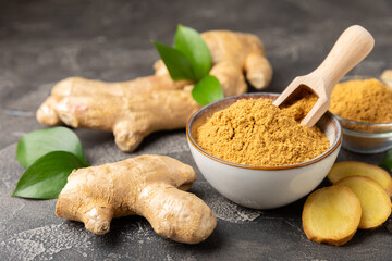 Fresh ginger on wooden background. Dry ginger. Sliced ​​ginger with honey and lemon. Ginger...