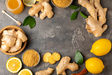 Fresh ginger on wooden background. Dry ginger. Sliced ​​ginger with honey and lemon. Ginger...