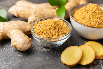 Fresh ginger on wooden background. Dry ginger. Sliced ​​ginger with honey and lemon. Ginger...