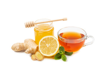 Cup of hot ginger tea with slices of ginger root isolated on white background. Warming drink. Alternative medicine. Tea with honey, lemon, ginger and mint. Space for text. Copy space