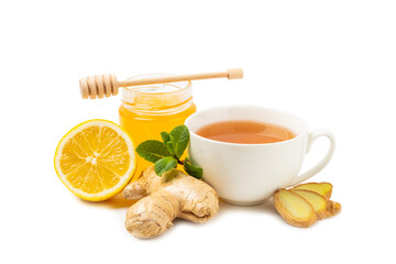Cup of hot ginger tea with slices of ginger root isolated on white background. Warming drink....
