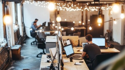 A modern co-working space featuring desks, laptops, and string lights environment