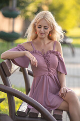 Portrait of a young beautiful blonde girl in nature.