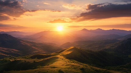 Obraz premium Breathtaking sunset over rolling mountains.