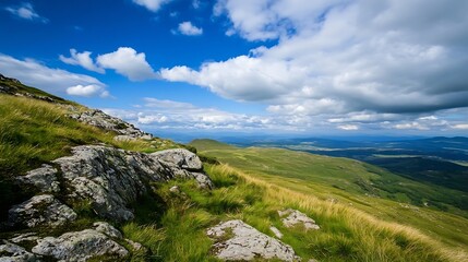 Fototapeta premium Stunning panoramic view of rolling hills under blue skies with fluffy clouds and vibrant grass : Generative AI