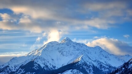 Obraz premium Majestic SnowCapped Mountain Peak Under a Dramatic Sky Showcasing Nature's Grandeur : Generative AI