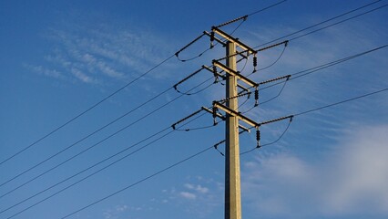 metallic electric tower against the blue sky