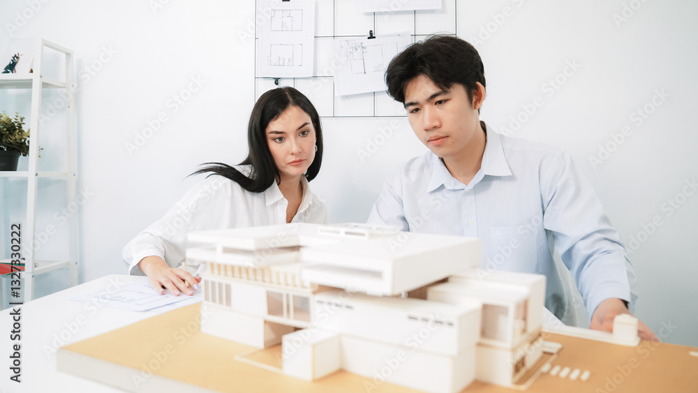 Aufkleber closeup of skilled architecture engineer team measure and decide house model while working together 