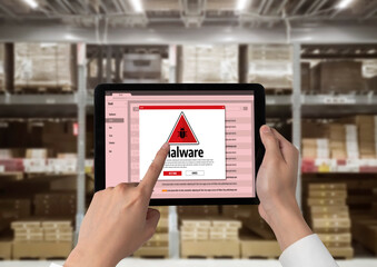 Cyber attacking concept. Malware alert showing on computer screen display scam and threat detection on computer system or online server to be removed snugly.