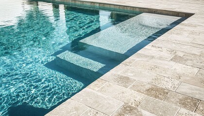 Elegant swimming pool with stone tile decking and crystal clear water