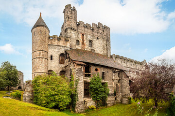 External view of the medieval stone walls of the Castle of the Counts (Gravensteen) in Ghent, Belgium