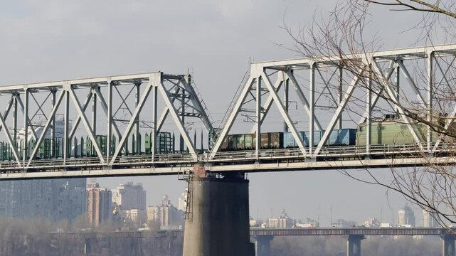 Train Moving Across Railway Bridge Over Rive.  Cargo Transportation In Modern City