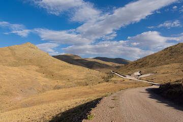 photographs of rural areas, landscapes and arid mountains and hills.
