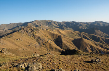 photographs of rural areas, landscapes and arid mountains and hills.