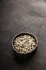 Sesame spice mix white and black tasty fresh gourmet food background on table rustic food top view copy space keto and paleo diet vegetarian and vegan food